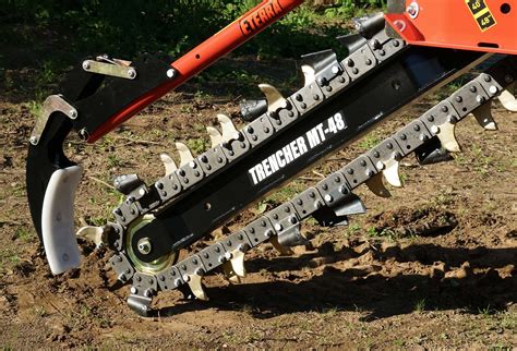 digging a trench with a skid steer|kubota skid steer trencher attachment.